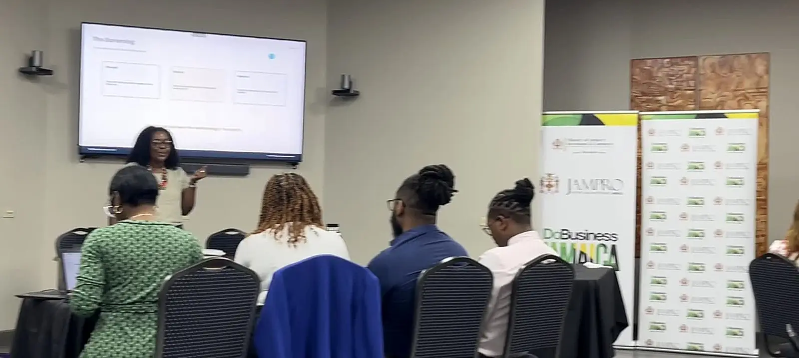 Participants following a presentation during the Assembling Your AI Team workshop delivered for JAMPRO